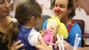 clown with child receiving a shot